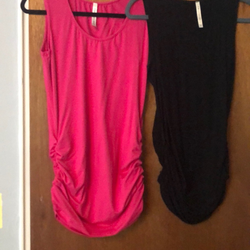 sleeveless tunic selling both black and pink for40